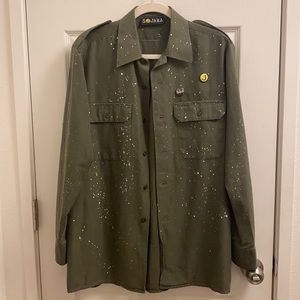 SOJARA Army Green oversized jacket. White paint splattered all over.